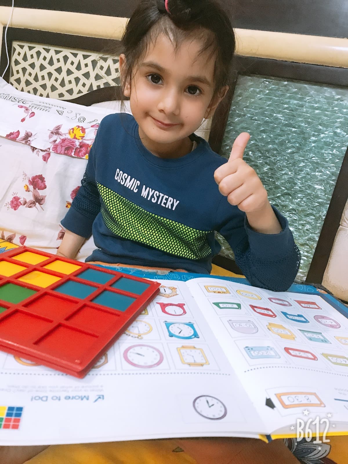 A child enjoying a GKL activity book