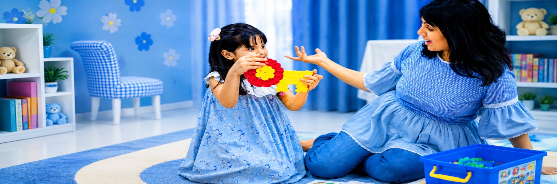 A child and mother exploring a GKL learning activity